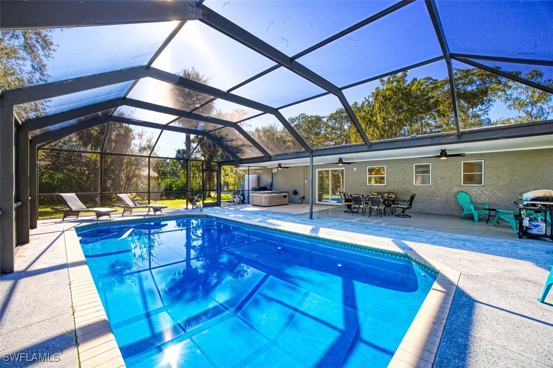 a view of a patio with swimming pool table and chairs