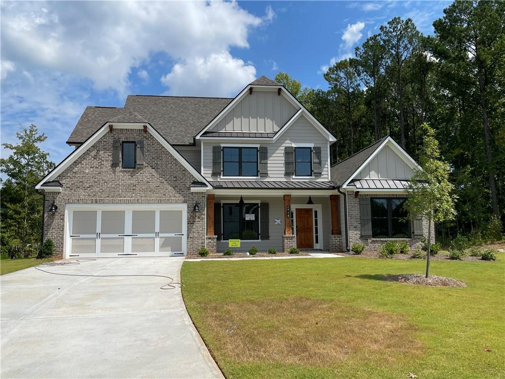 a front view of a house with a yard