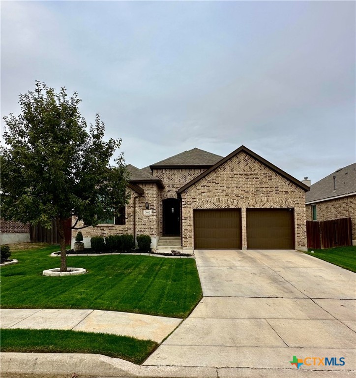 a front view of a house with a yard