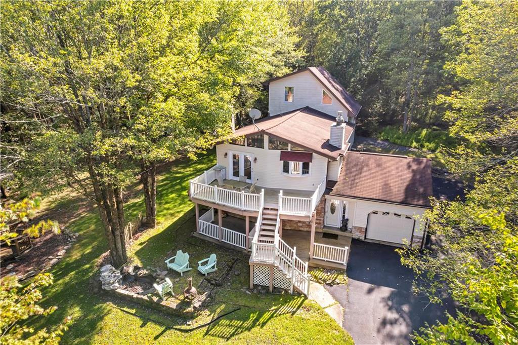 a aerial view of a house with a yard