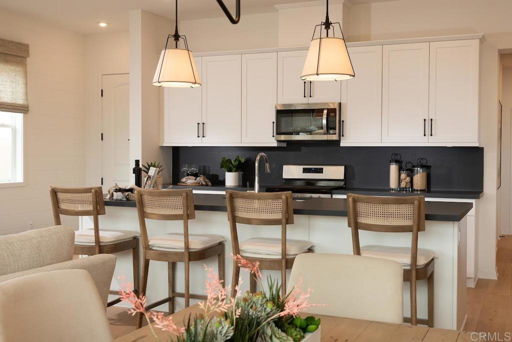 a view of kitchen and dining area with furniture