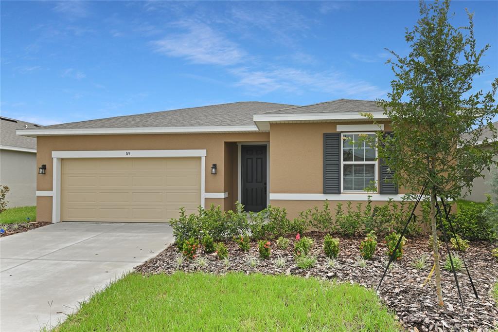 front view of a house with a yard