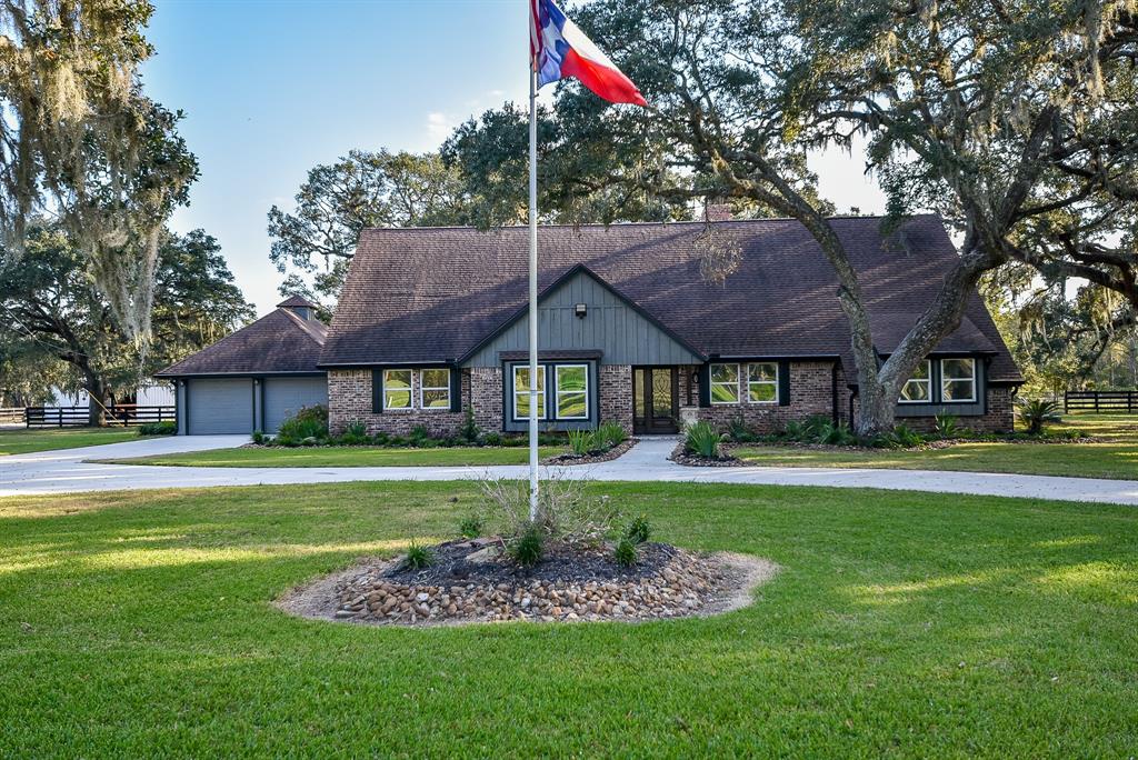 A proud flying of the American and Texas flags announce this to be a country home and acreage one would imagine in their dreams.  Country living can be found here without giving up entirely on city amenities.  A primary feature of this property is a 11-stall horse stable and divided open land that lends itself to horses or livestock.  Texas living through and through!