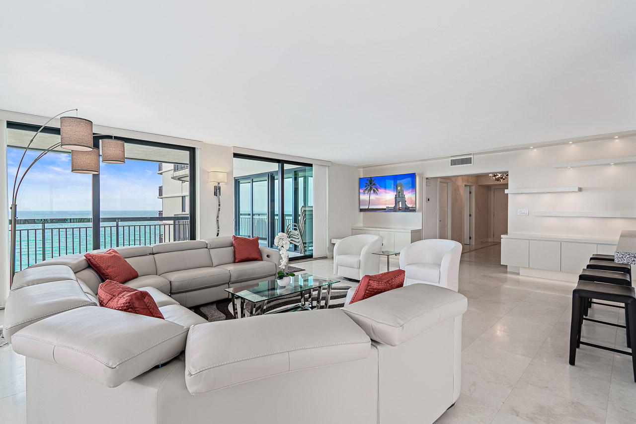 a living room with furniture and a table