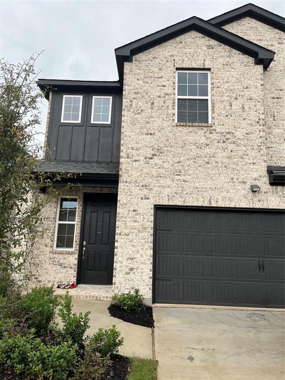 a front view of a house with garage