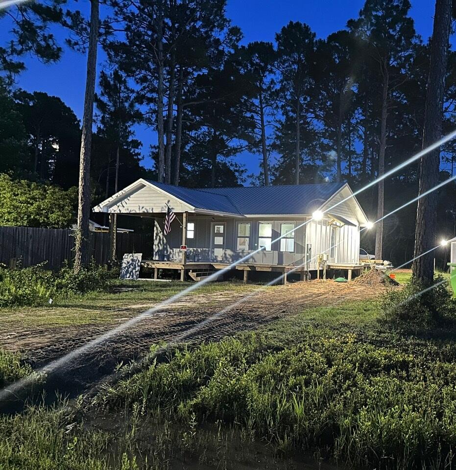 a view of a big yard next to a house