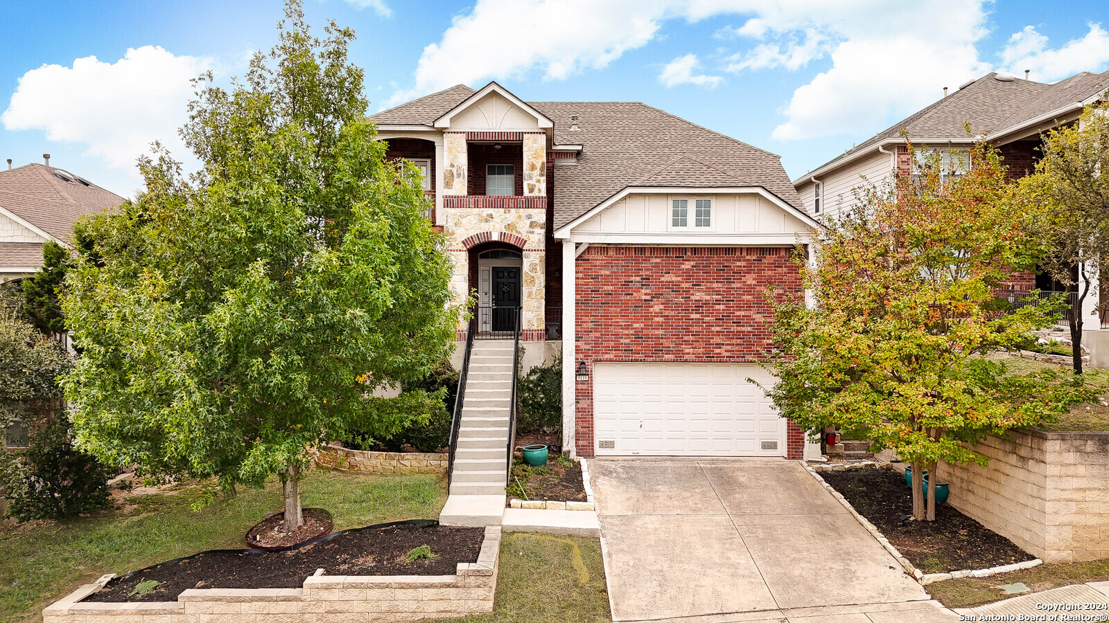 a front view of a house with garden