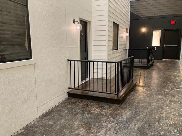 a view of a porch with wooden floor