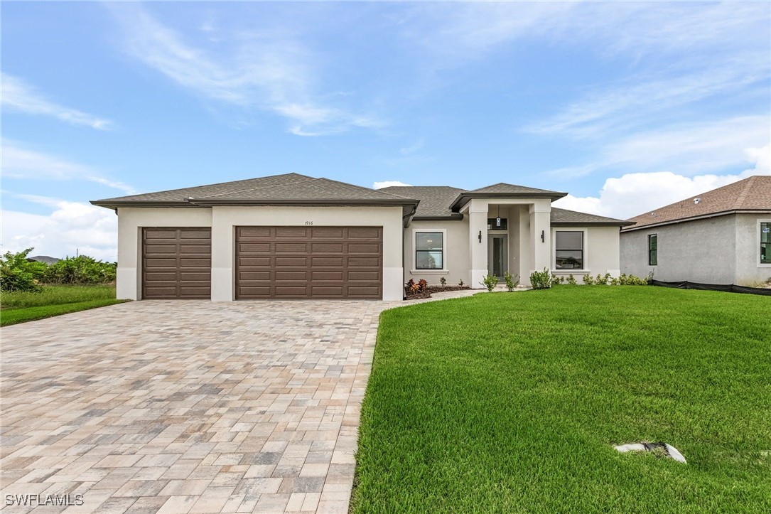 a front view of a house with a yard