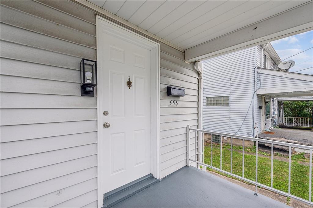 a view of front door and yard