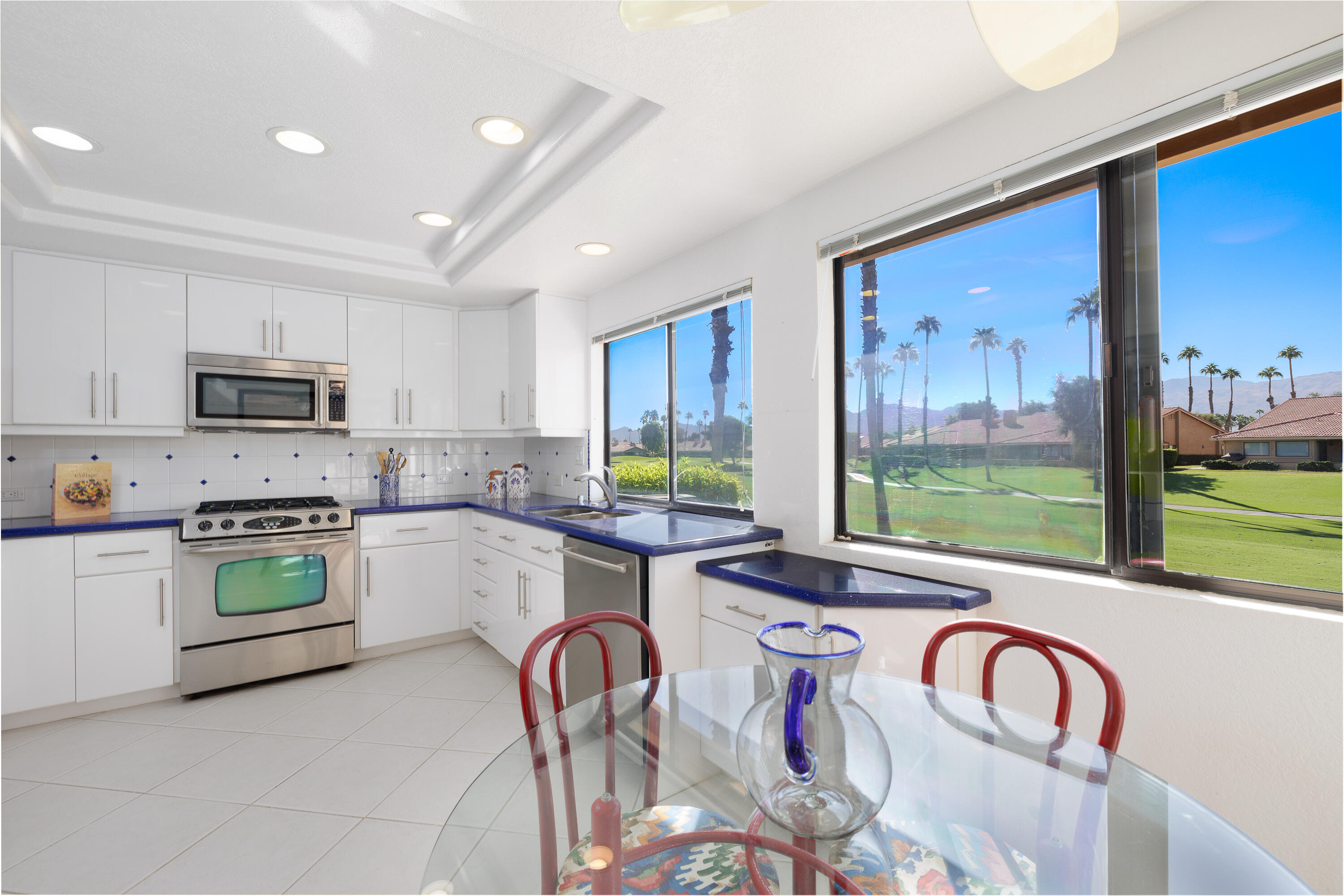 a kitchen with sink cabinets and window