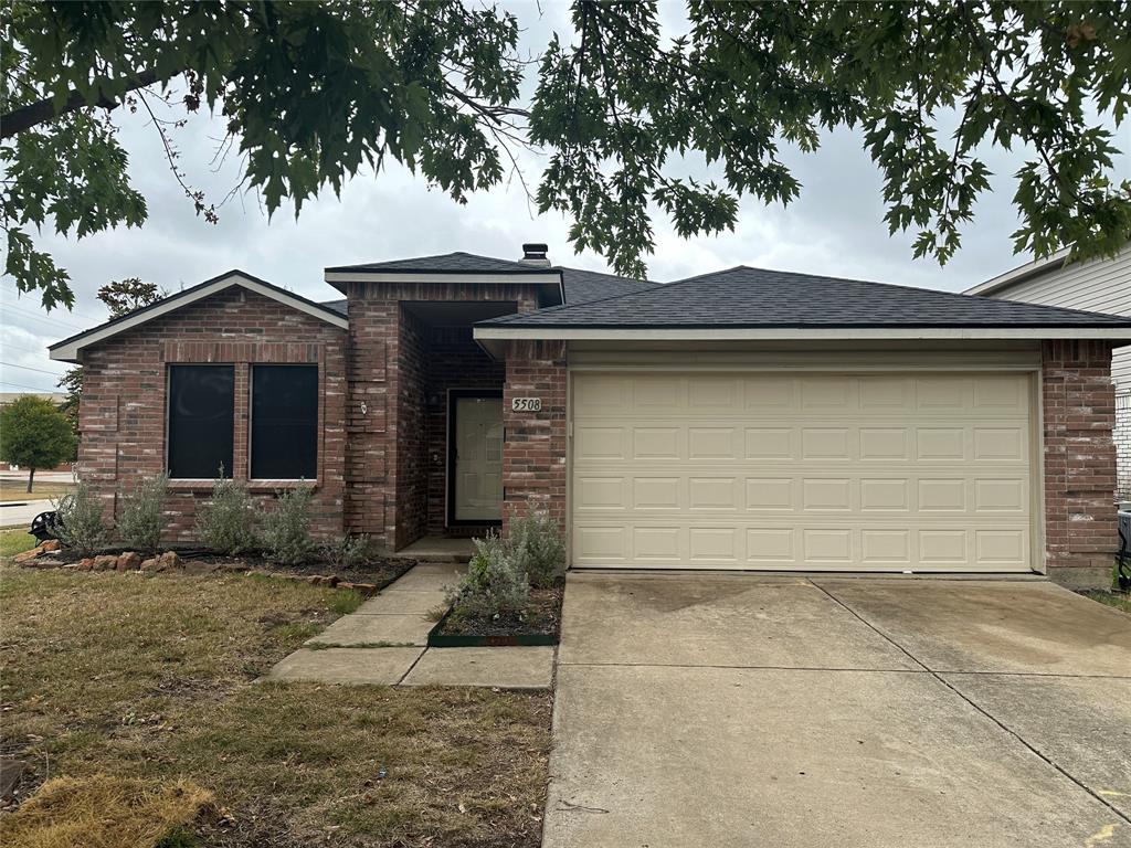 a front view of a house with garage