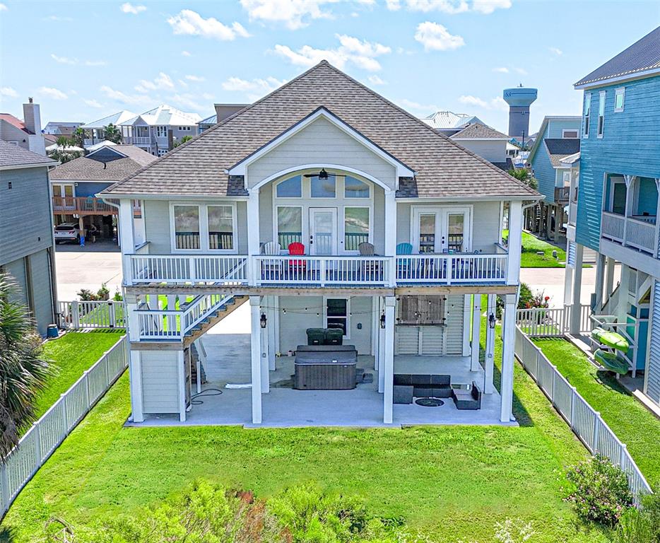 a front view of house with outdoor seating and yard