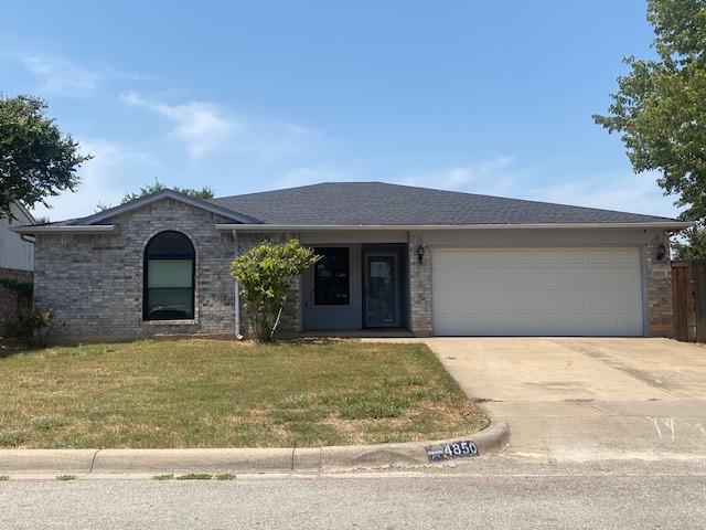 a front view of a house with yard