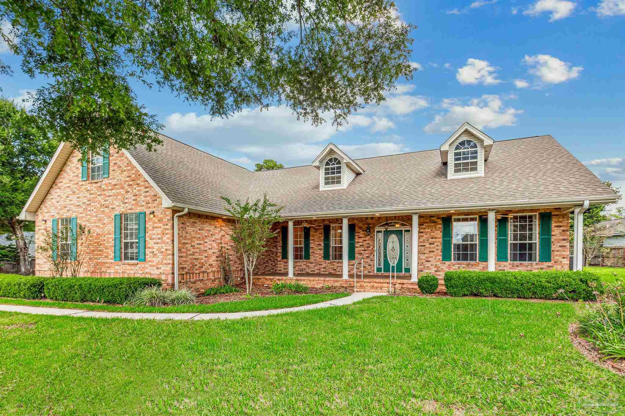 front view of a house with a yard