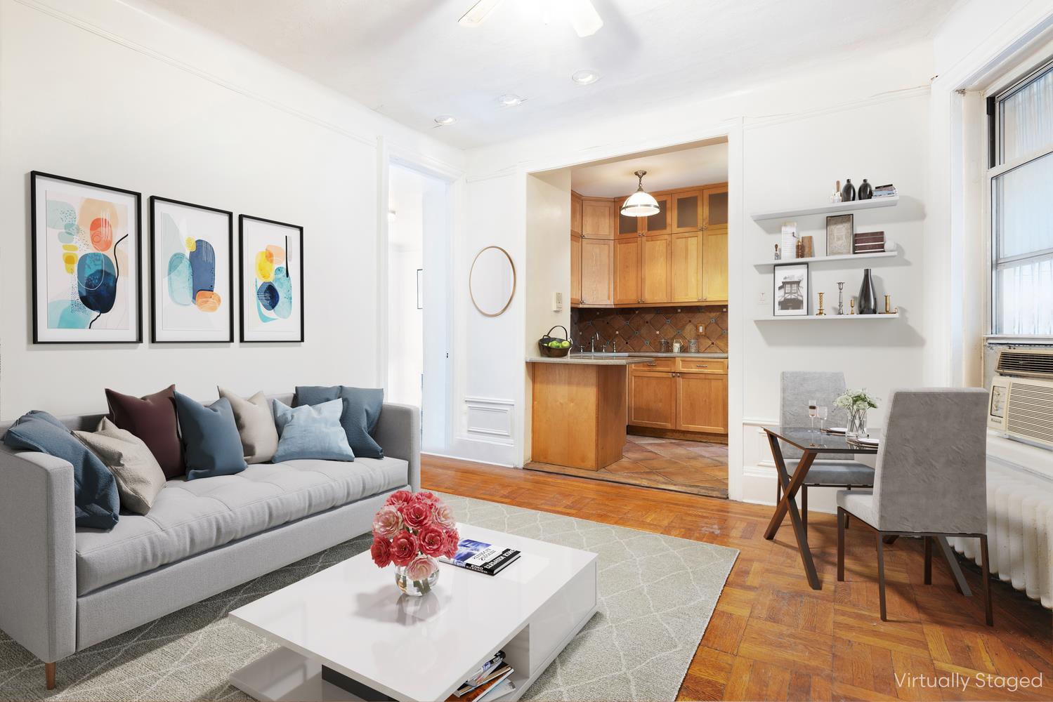 a living room with furniture and painting on the wall