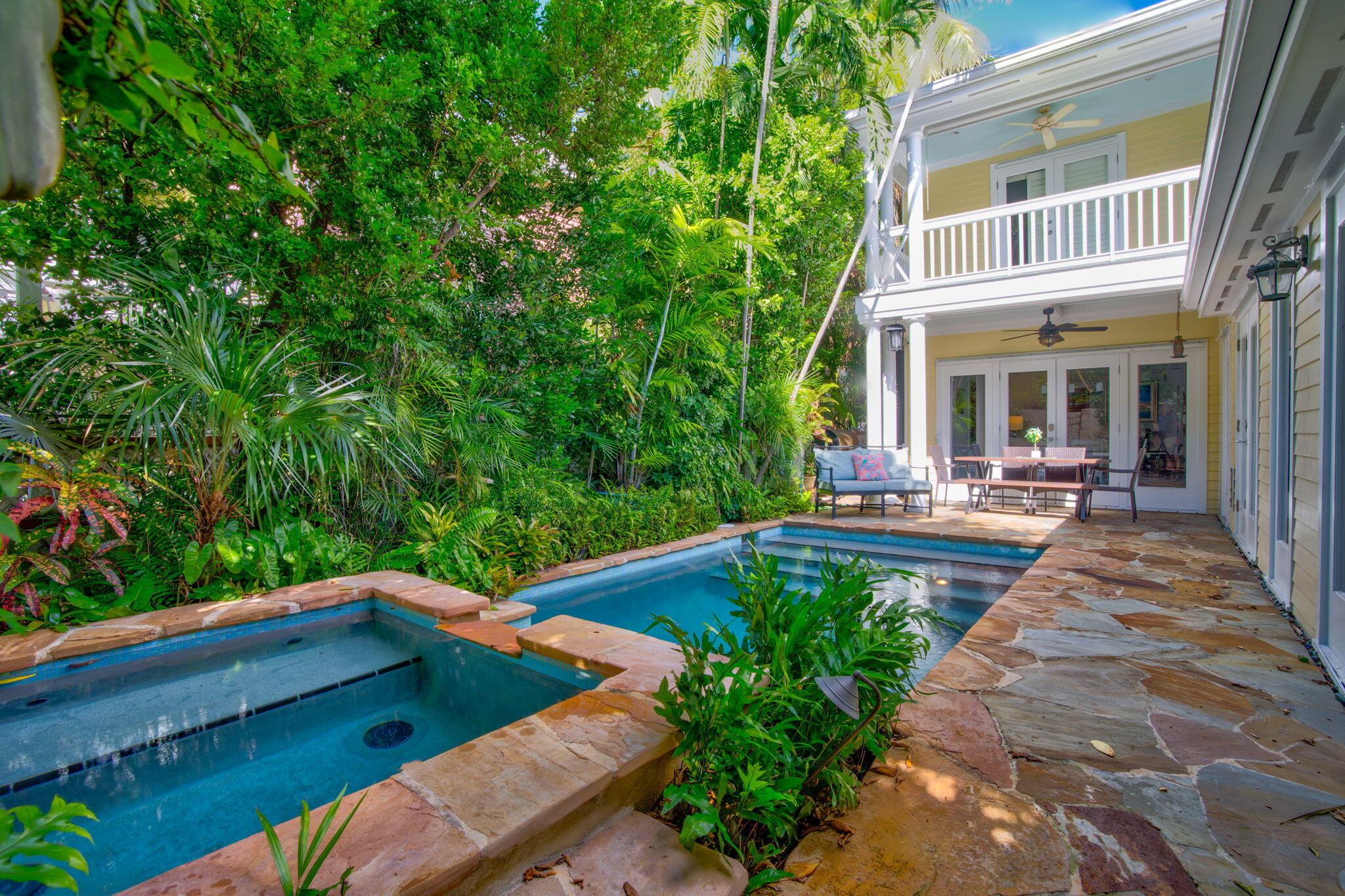 swimming pool view with sitting space and garden view