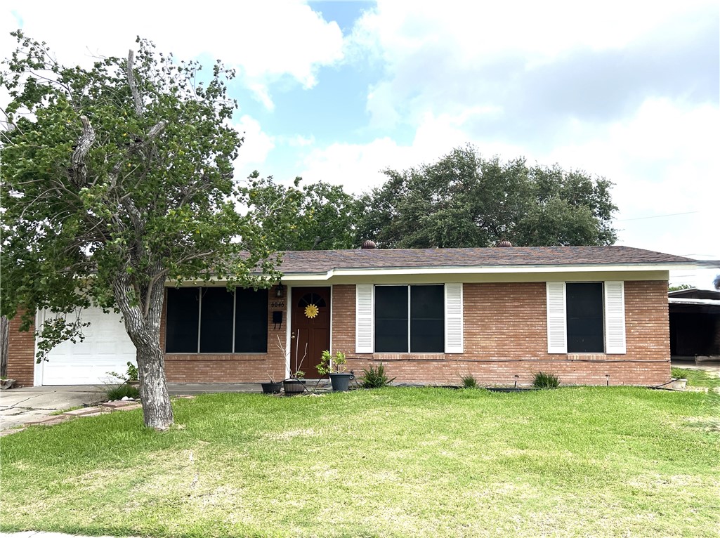 a backyard of a house with yard and barbeque oven