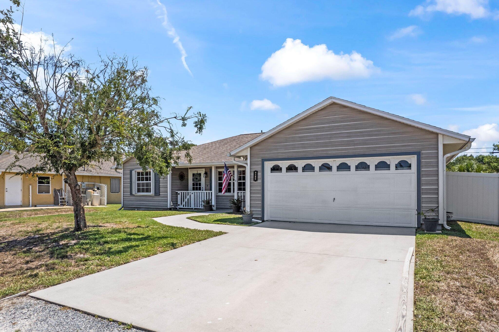 front view of a house with a yard