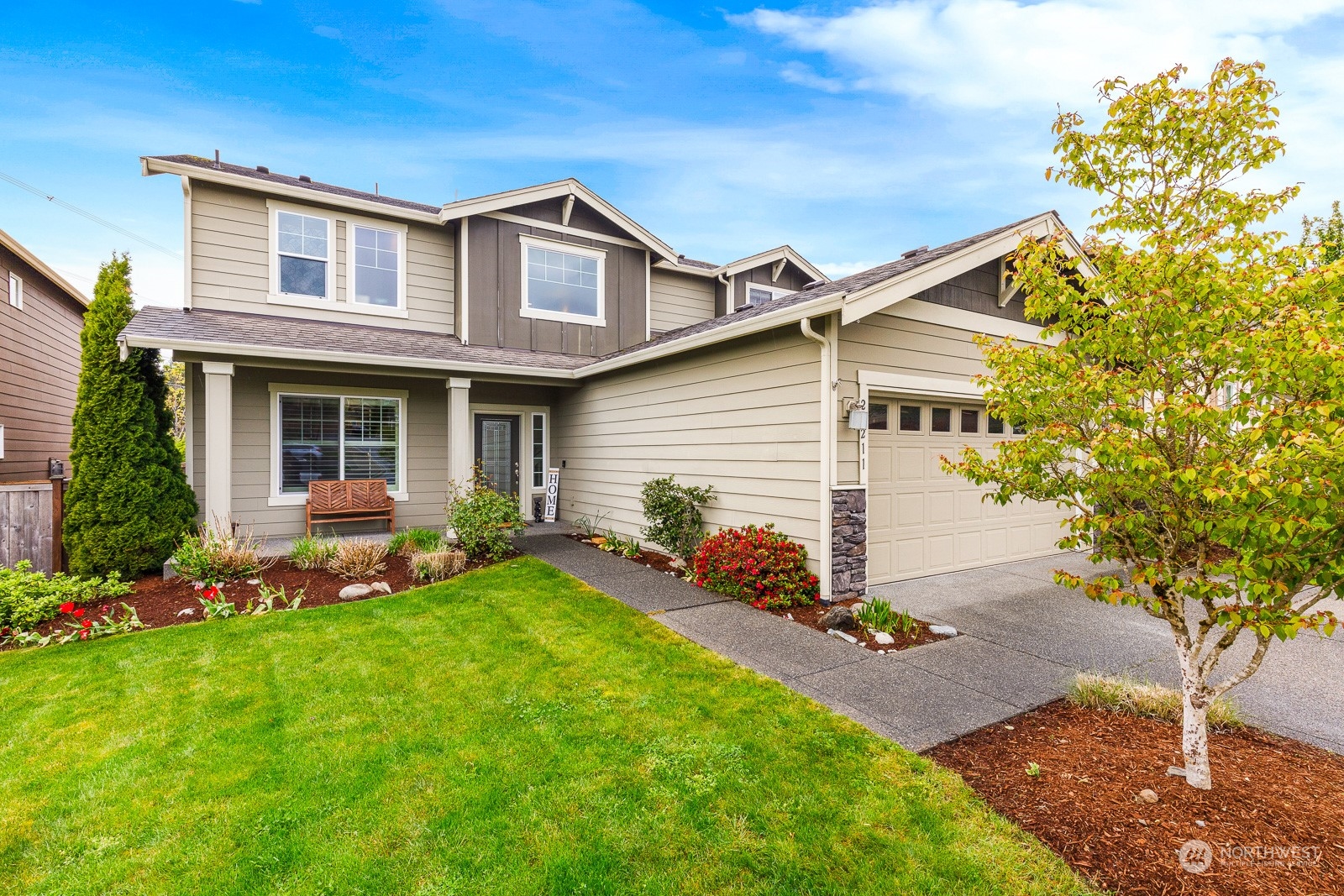 front view of a house with a yard