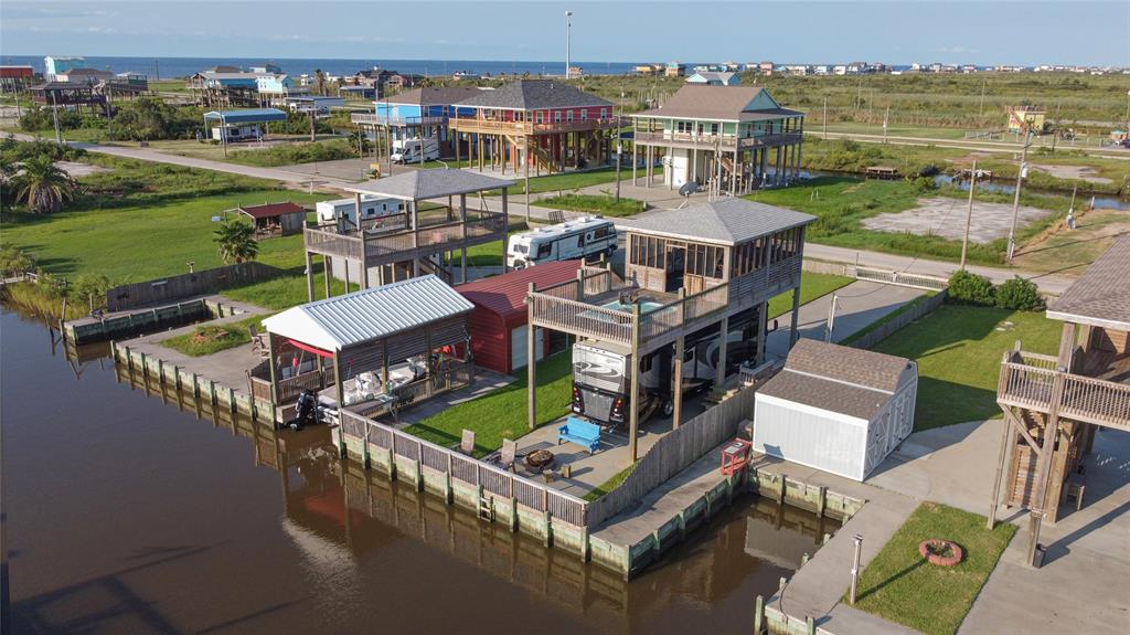 an aerial view of a house with a ocean view