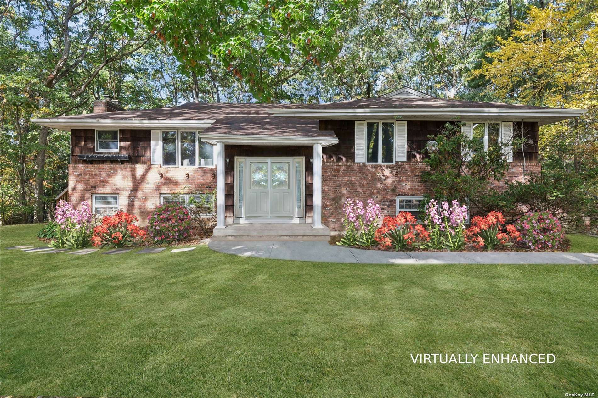 a front view of a house with a garden