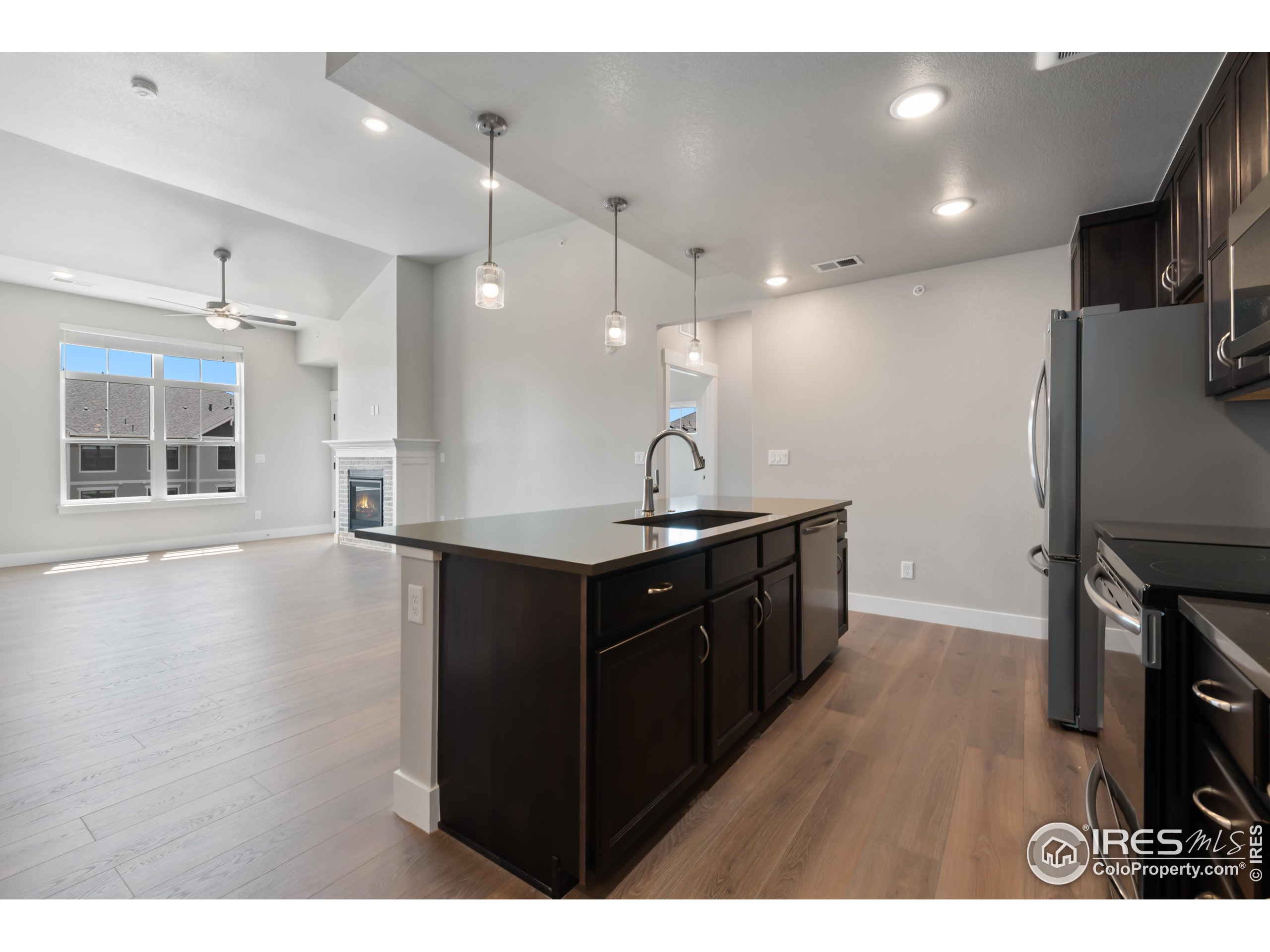 a kitchen with a refrigerator and a sink