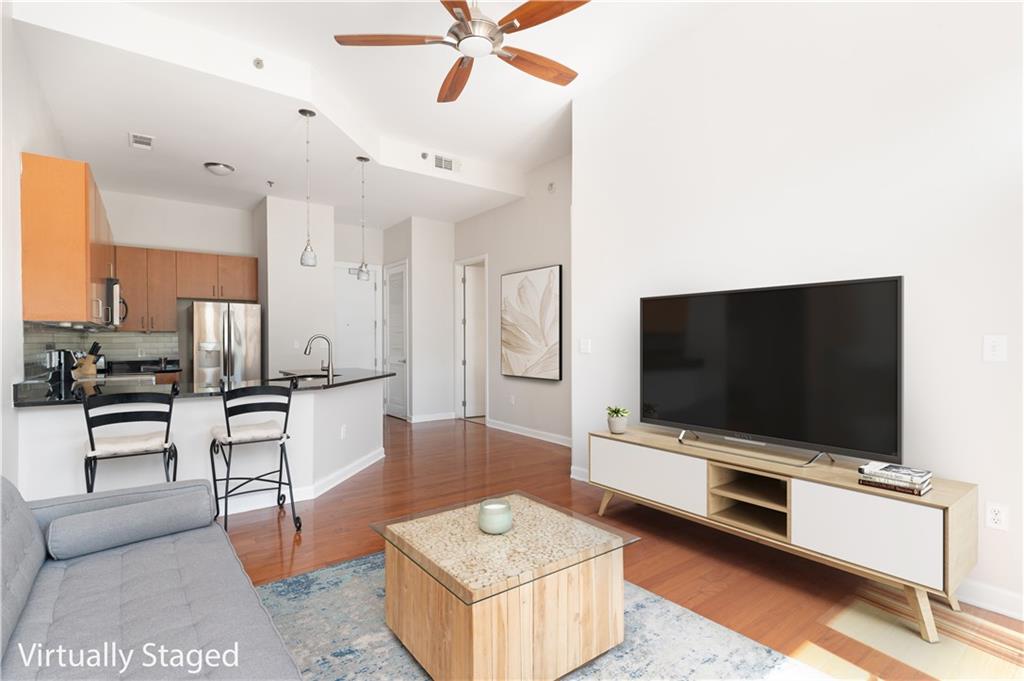 a living room with furniture and a flat screen tv