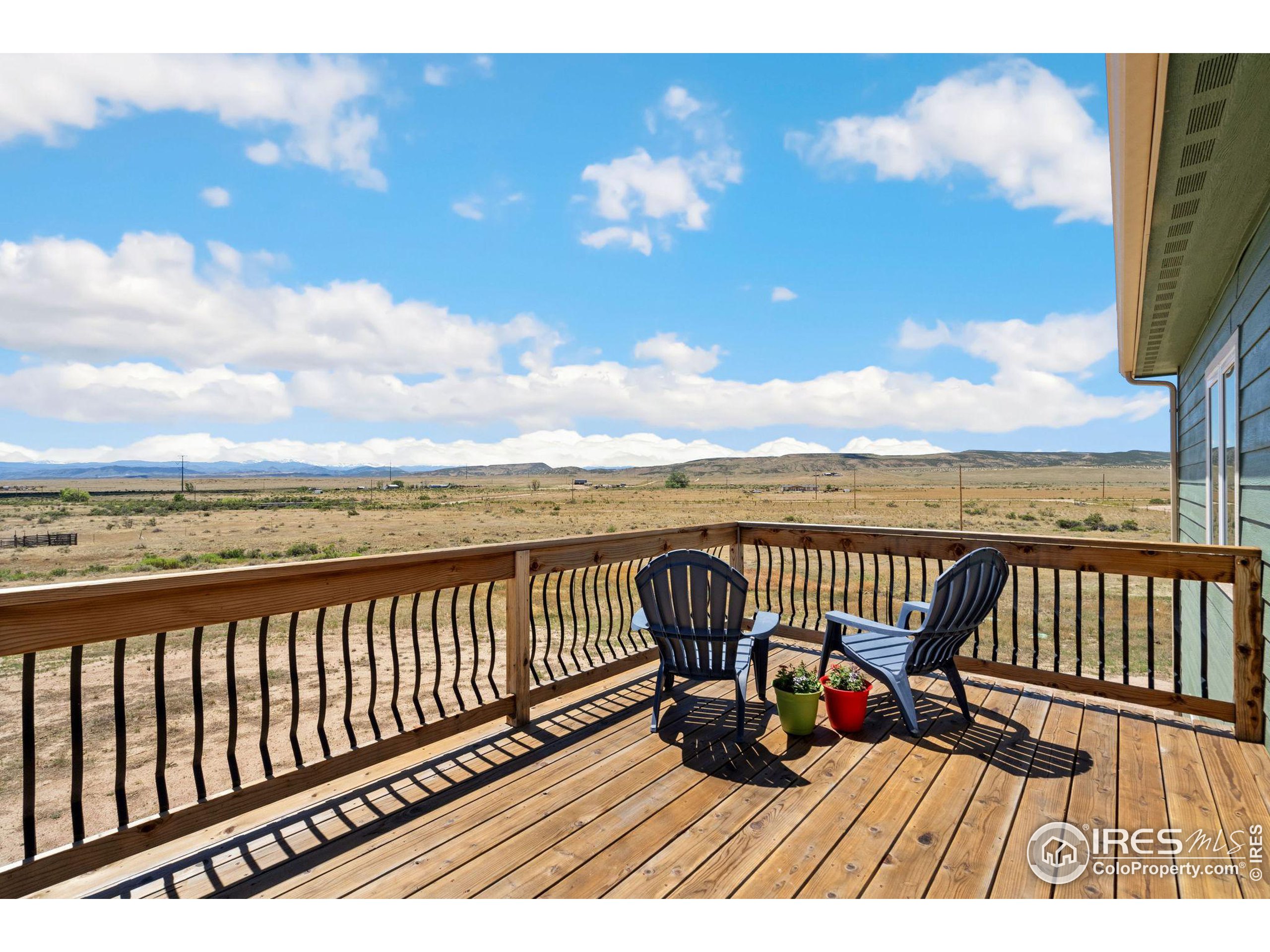 a view of balcony with wooden floor