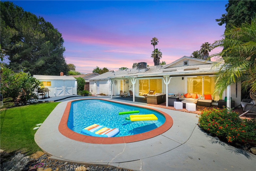 a view of a swimming pool with a patio