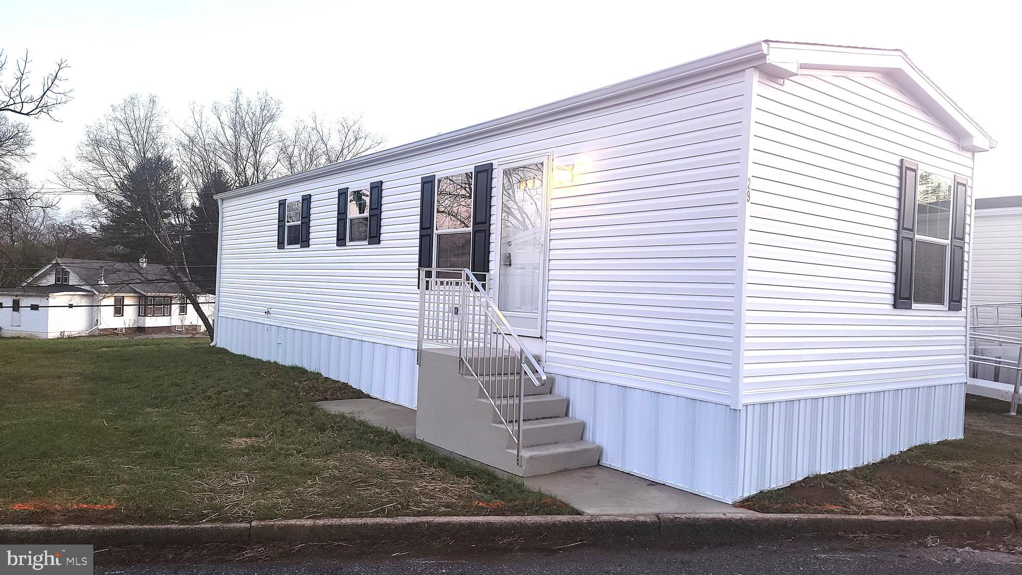 a view of a white house with a white door