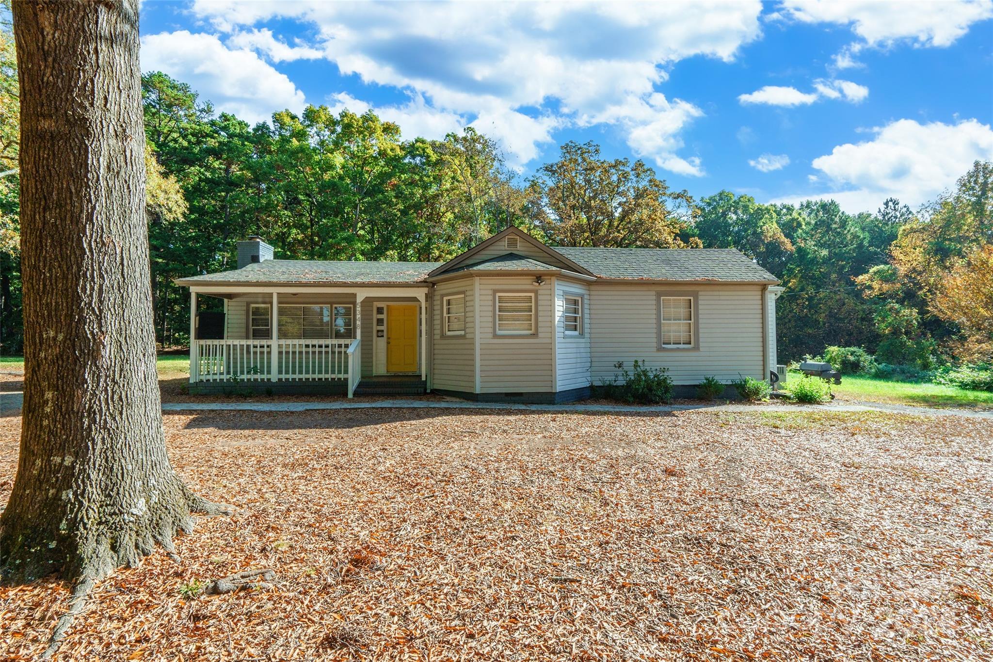 a house with trees in the background