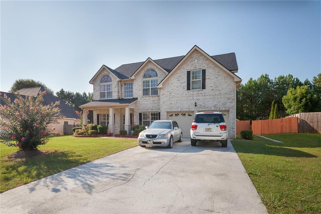 a houses view and a car parked in front of house