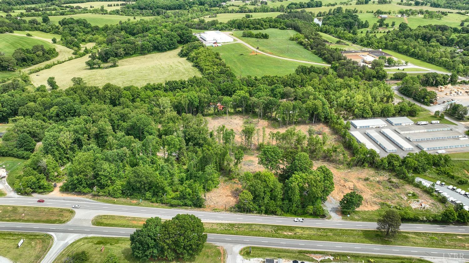 an aerial view of a houses with yard