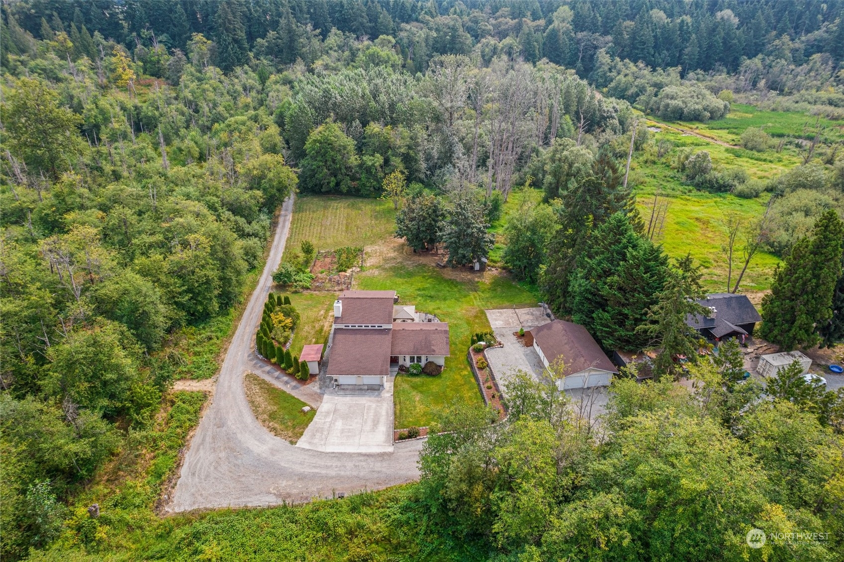 an aerial view of house with yard swimming pool and outdoor seating