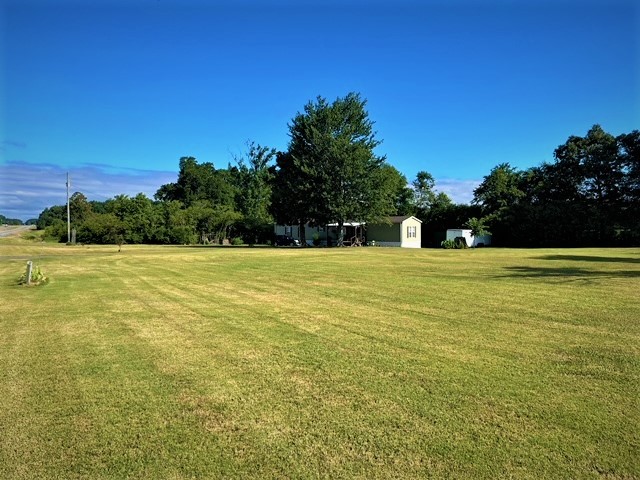 a view of a swimming pool with an outdoor space and seating area