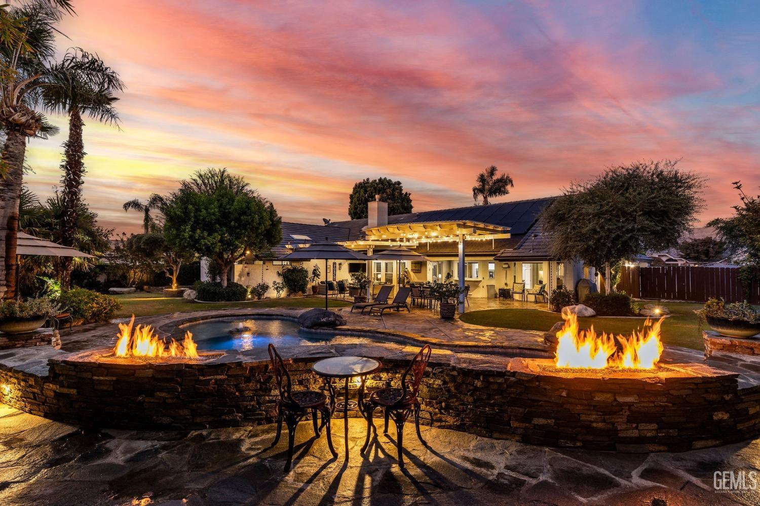 a view of a swimming pool with a patio