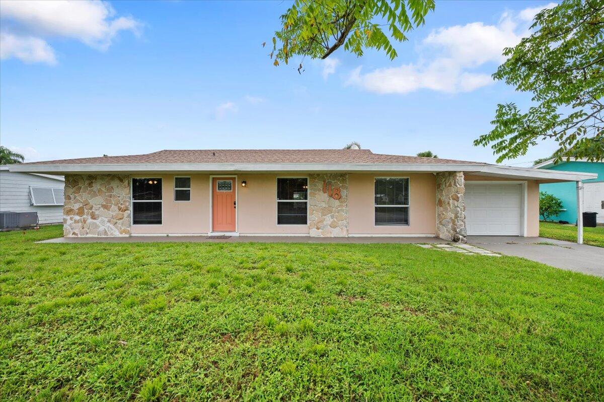 front view of a house with a yard