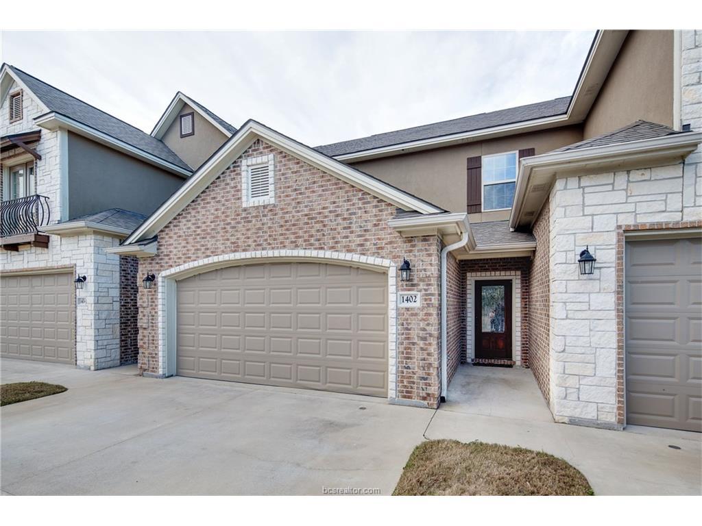 a view of outdoor space garage and front door