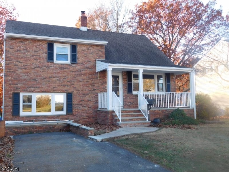 a front view of a house with garage