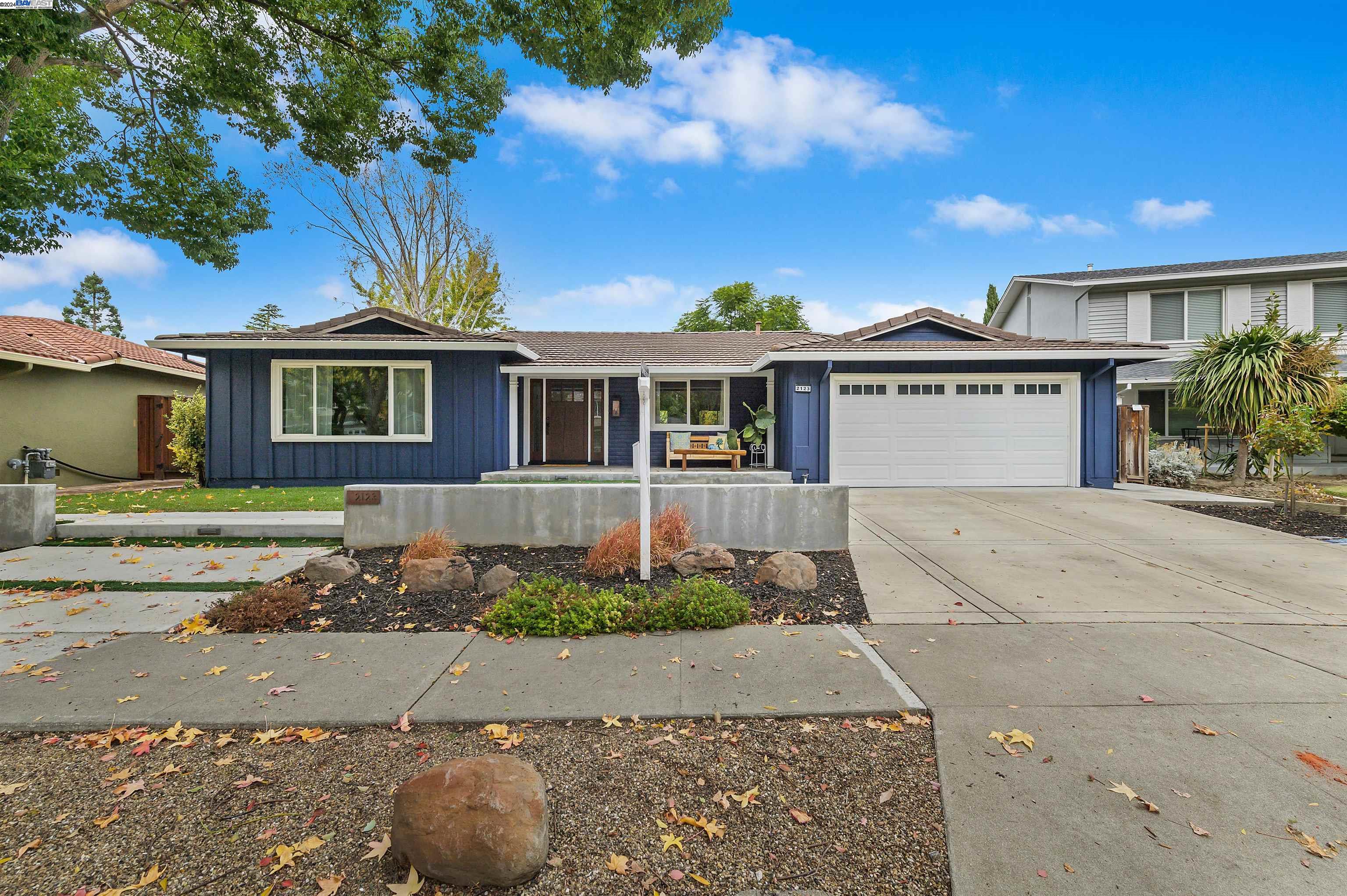 front view of a house with a yard