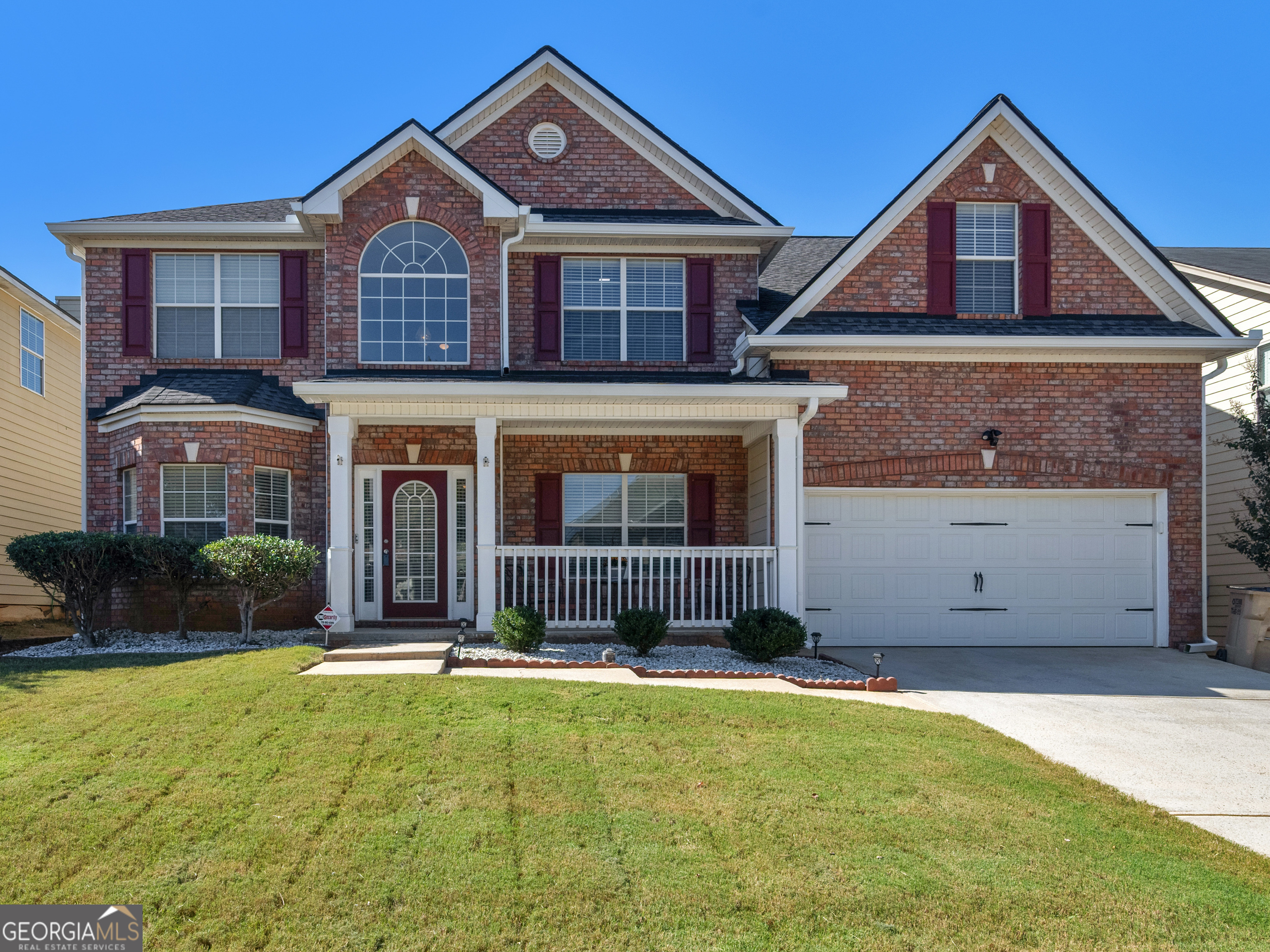 a front view of a house with yard