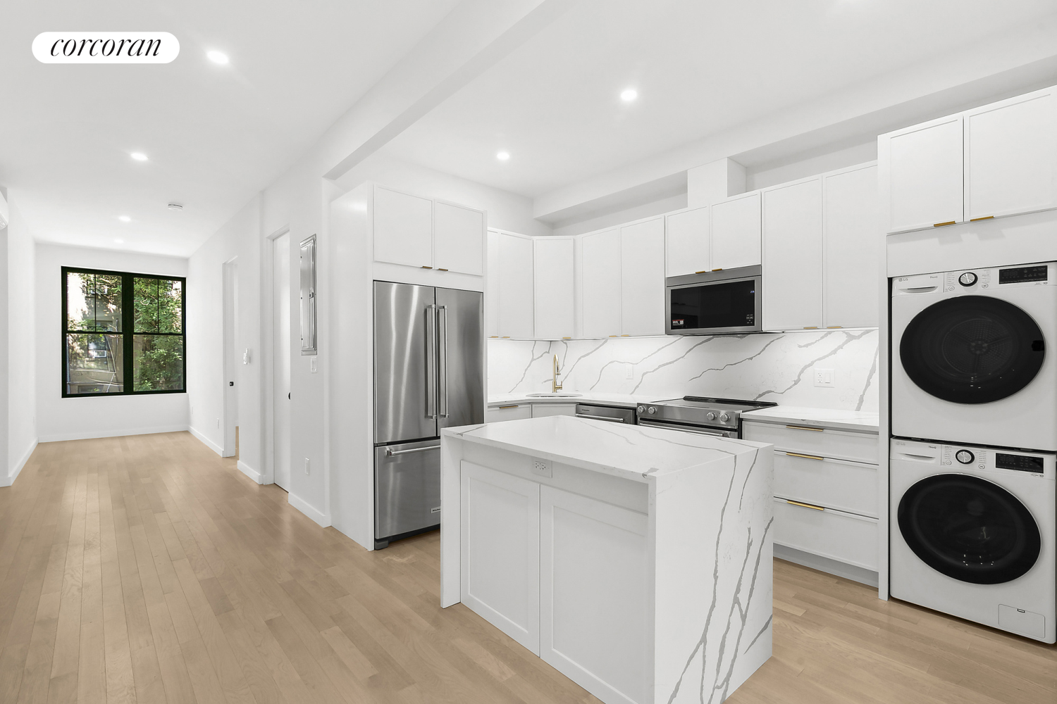 a kitchen with stainless steel appliances a stove a refrigerator and a sink