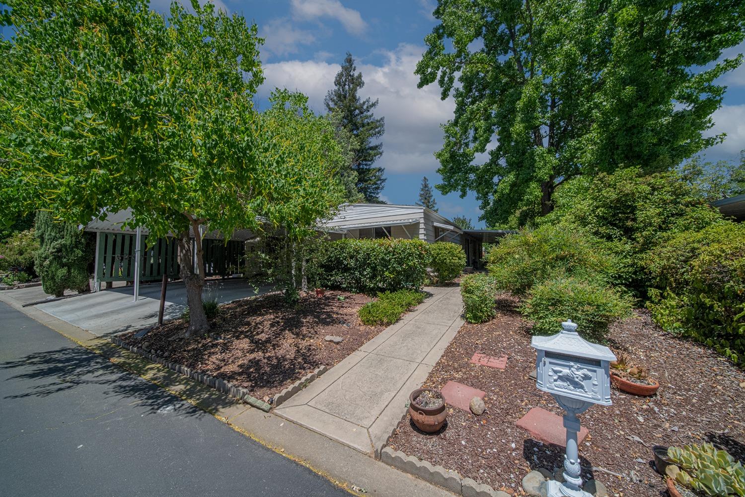 a view of a yard and front view of a house