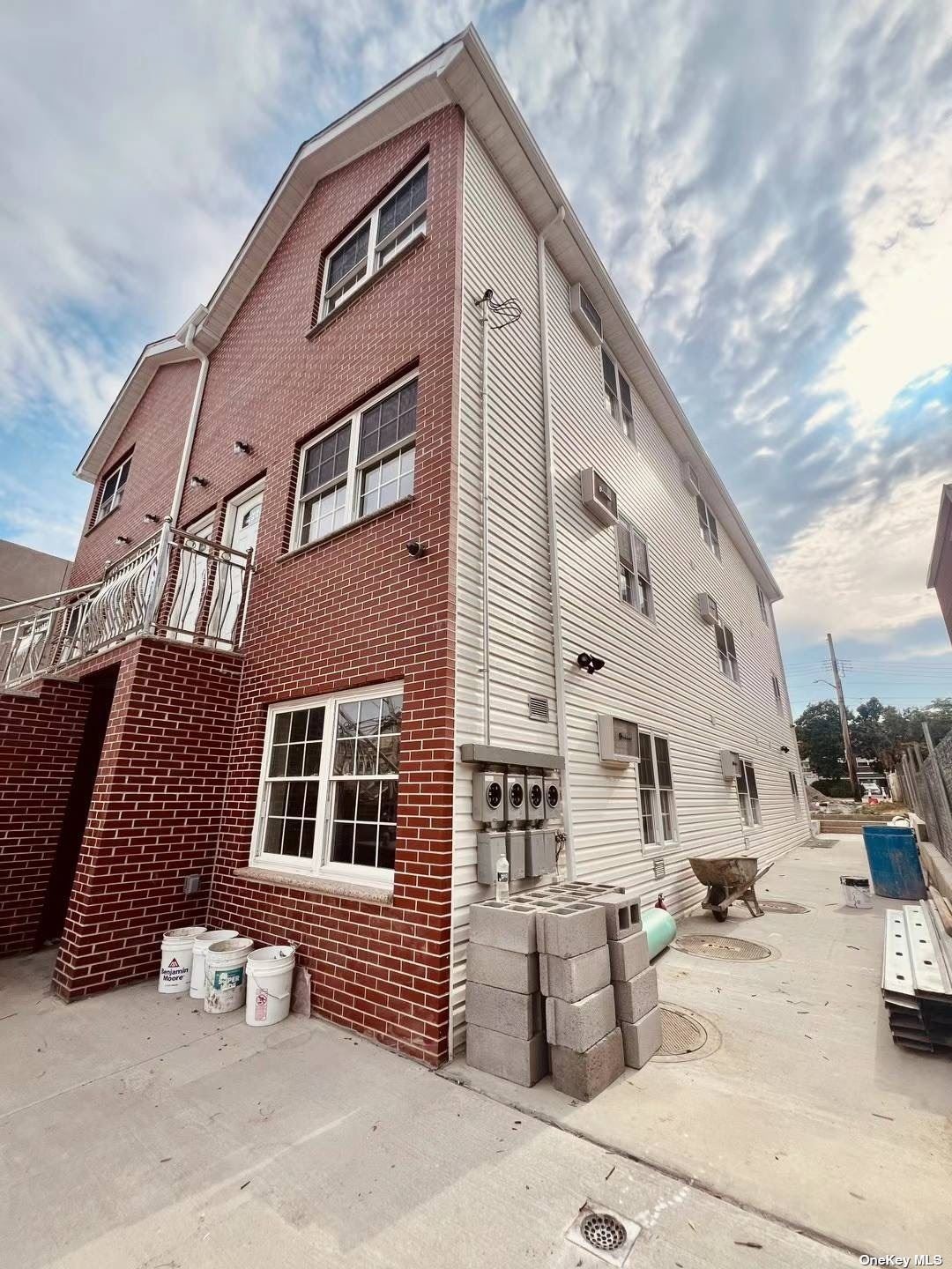 a front view of a building with outdoor seating