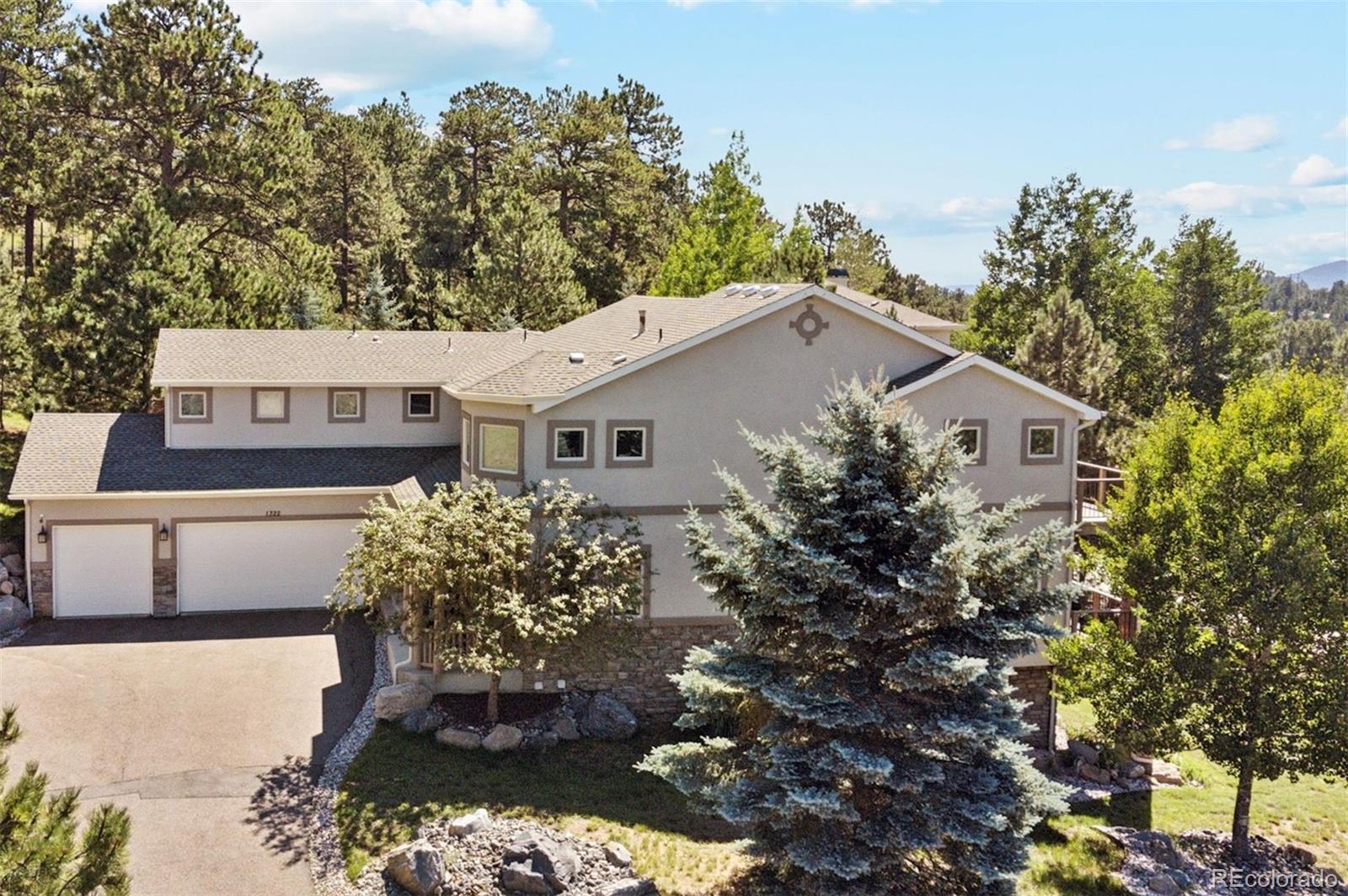 a aerial view of a house with a yard