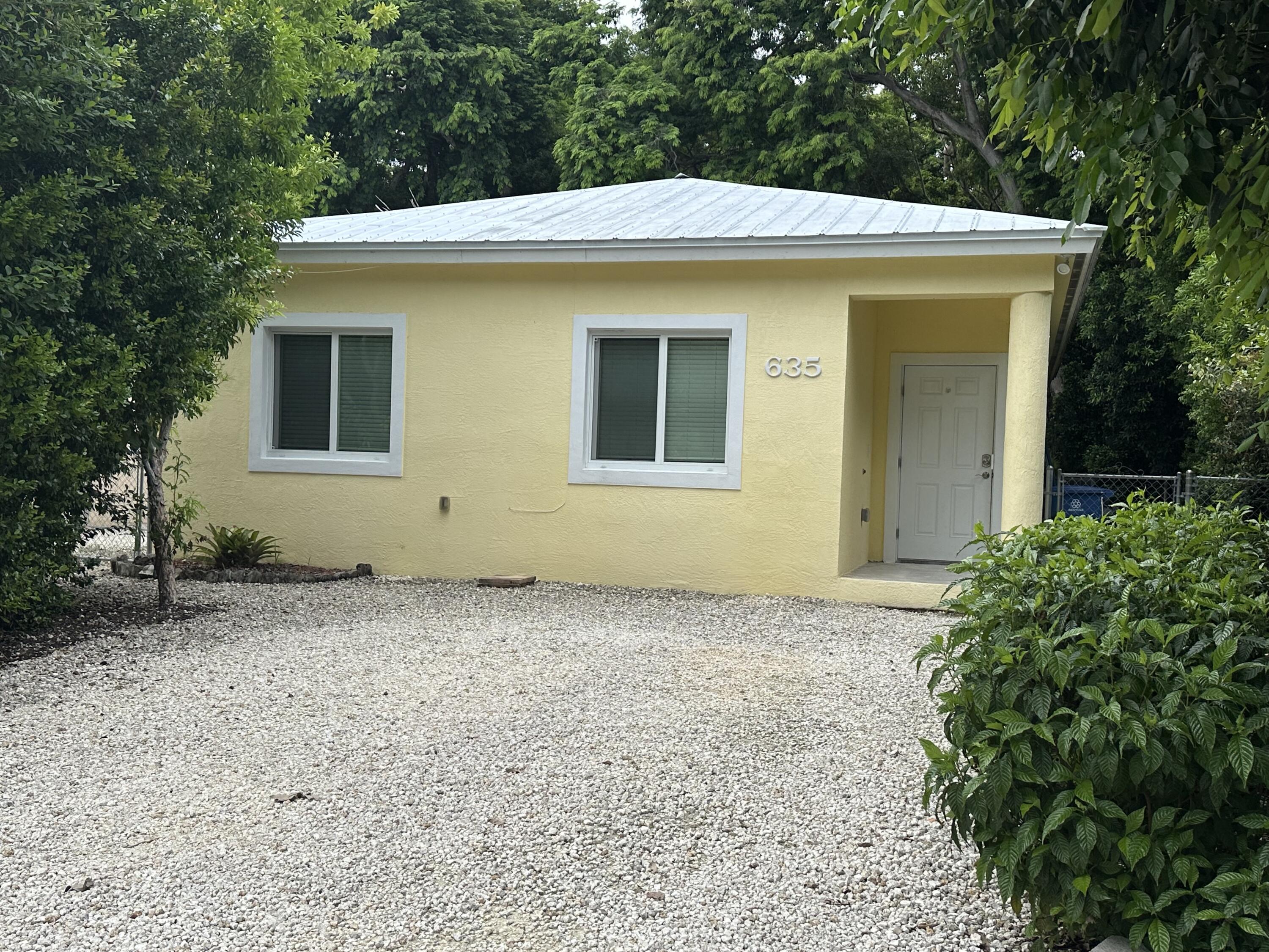 a house with trees in front of it