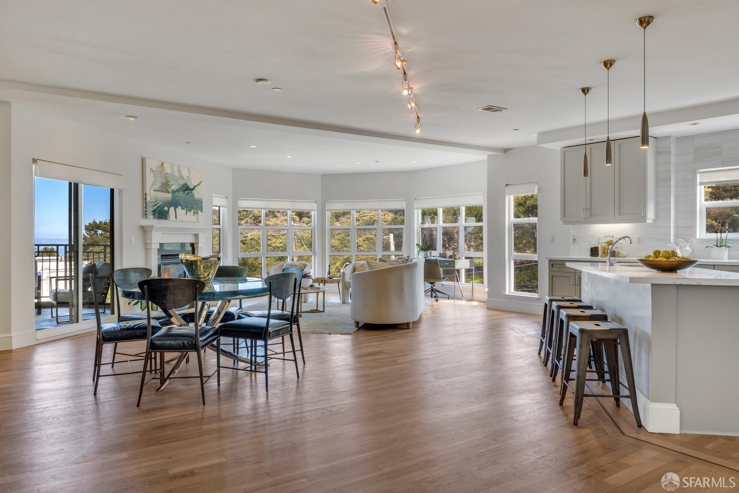 a view of a dining room with furniture window and wooden floor