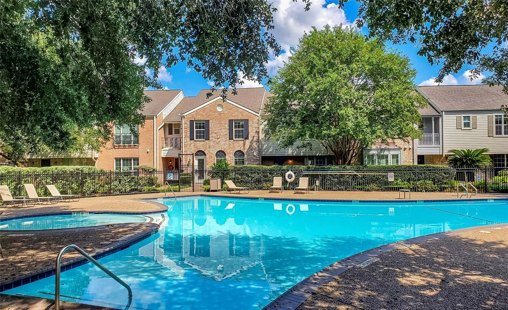 a view of a house with swimming pool and a yard