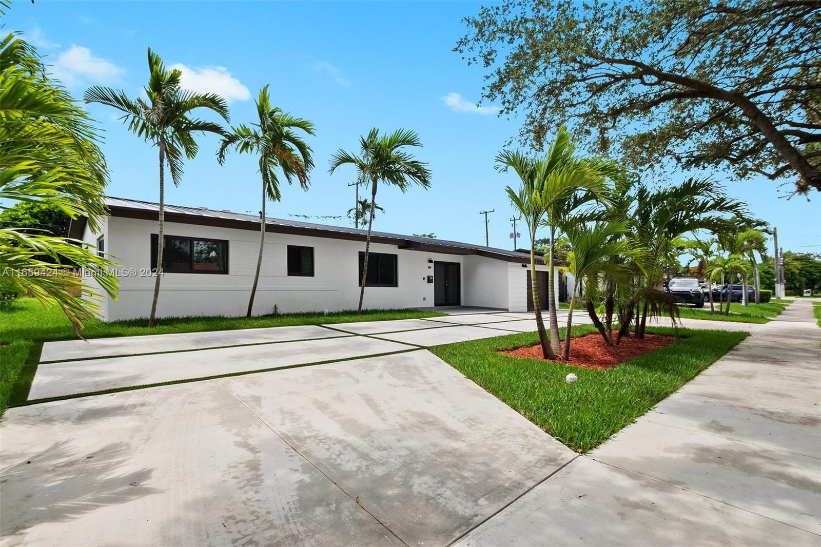 a house with palm tree in front of it